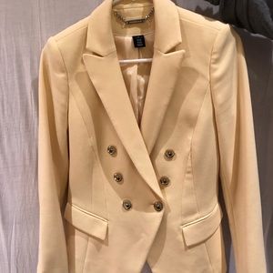 yellow blazer with gold buttons